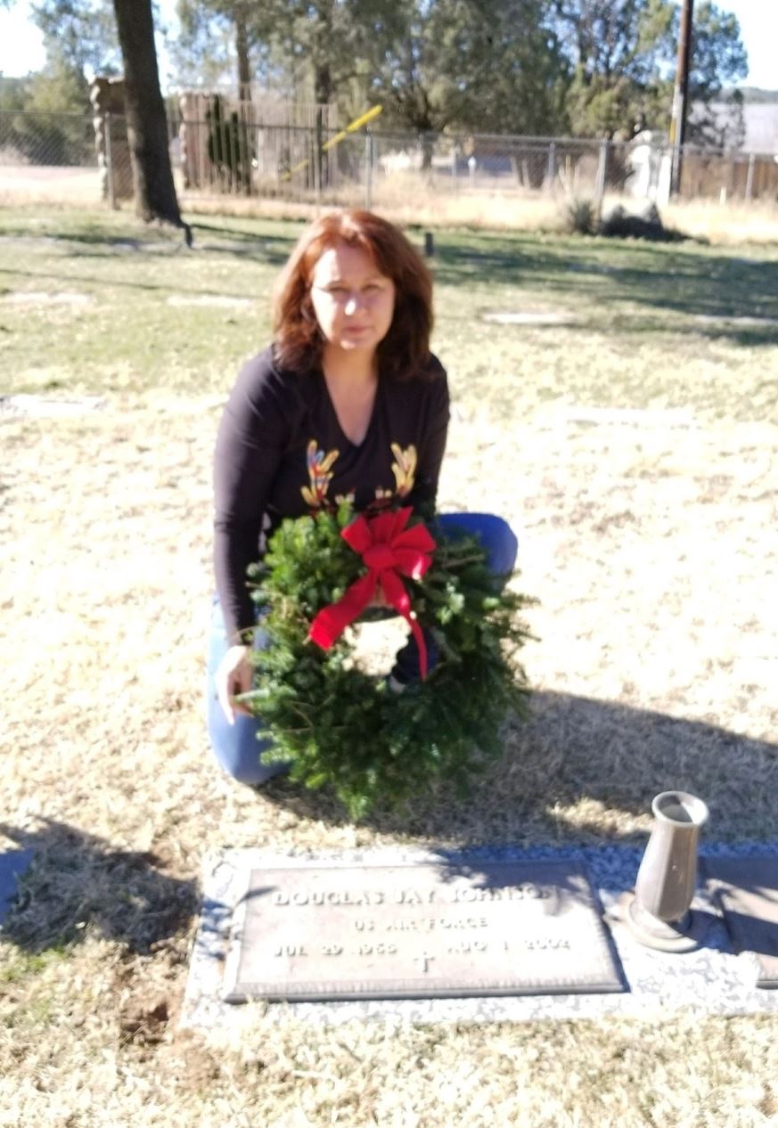 Teresa Montoya placing her late husband's wreath&nbsp;