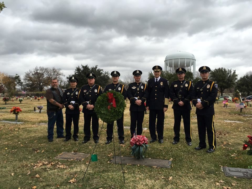 IPD Honor Guard, Chief Larry Boyd and Brian Guidry (Retired) at the grave of LOD Officer Glen Homs.