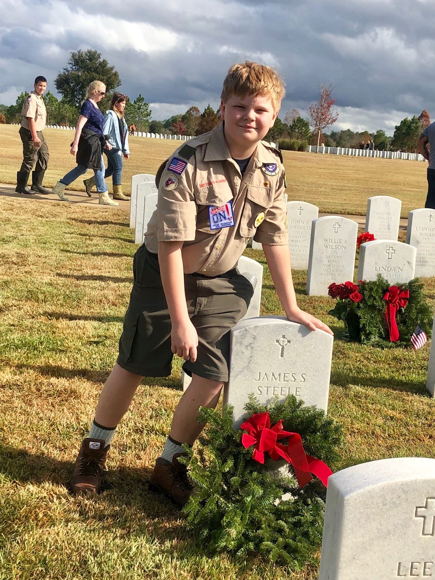 Conner Steele placing a wreath on his Grandfather's headstone at JNC, 12/15/2018 - WAA Day