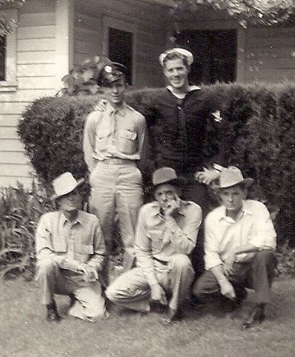 Best friends Merl Jones, army, and Eldridge Bailey (Navy) on leave in California during WWII. Seated are civilians Porter Jones, Ed Bailey unknown.