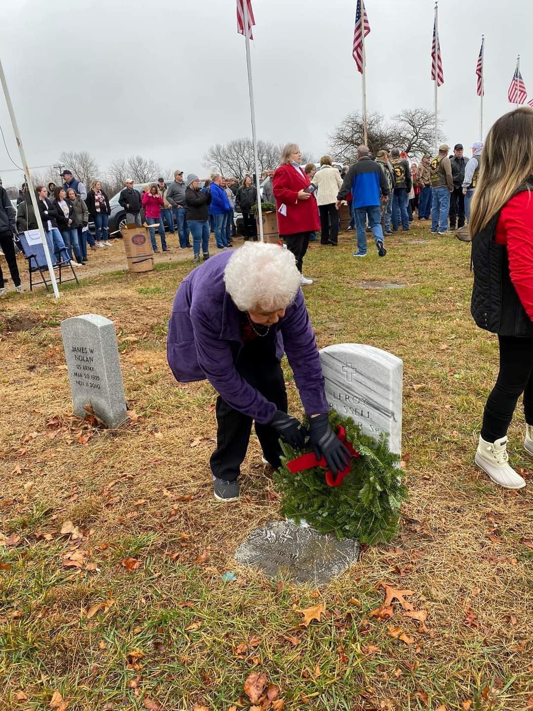 Irene Frazier, Mtn. View, placing her husband, Leroy Frazier's wreath on his grave.<br>