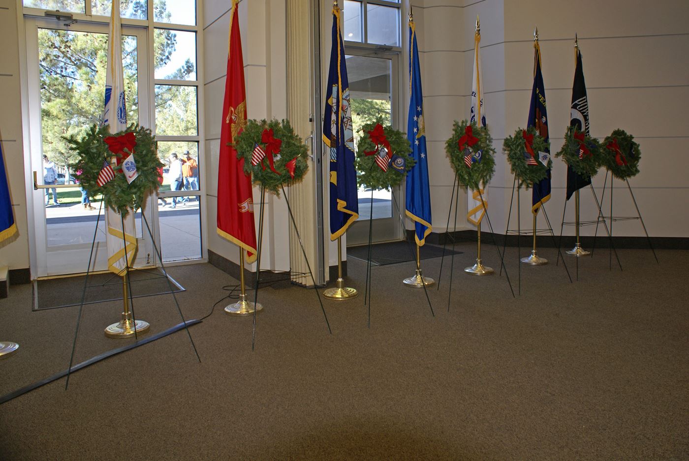 Each year a wreath is posted in front of each service flag in a ceremony in the Chapel at the SNV cemetery