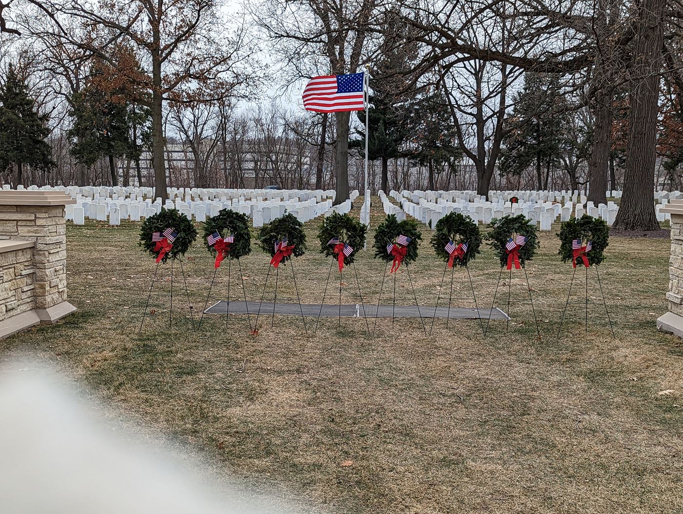 Wreaths representing each branch of service including POW and Merchant Marines