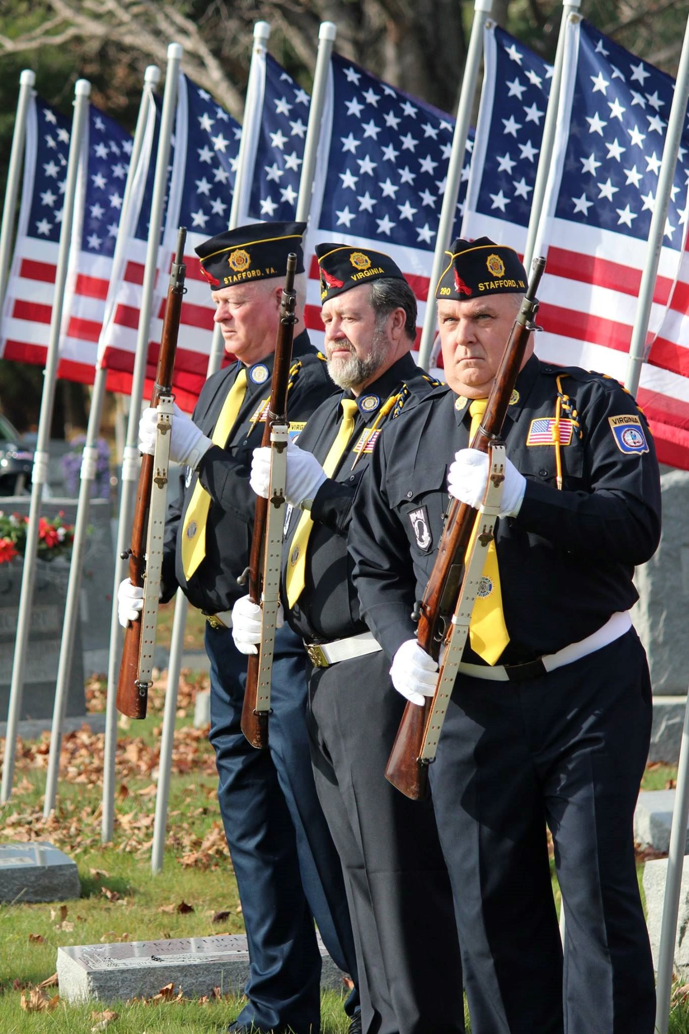 Post #290 American Legion presenting a 3 round volley