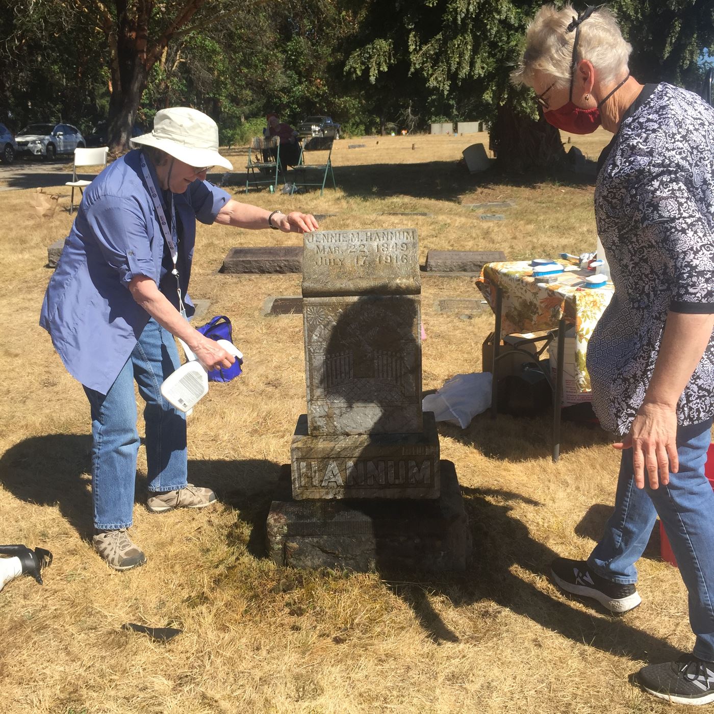 Daughters apply final spray of D2 that works with the weather to improve the monument.