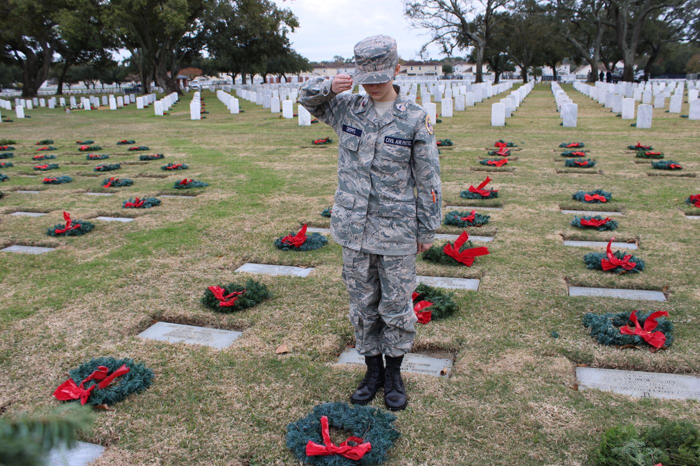 A moment of reflection and gratitude. Cadet Crepps honors those who sacrificed for our freedom with Wreaths Across America.