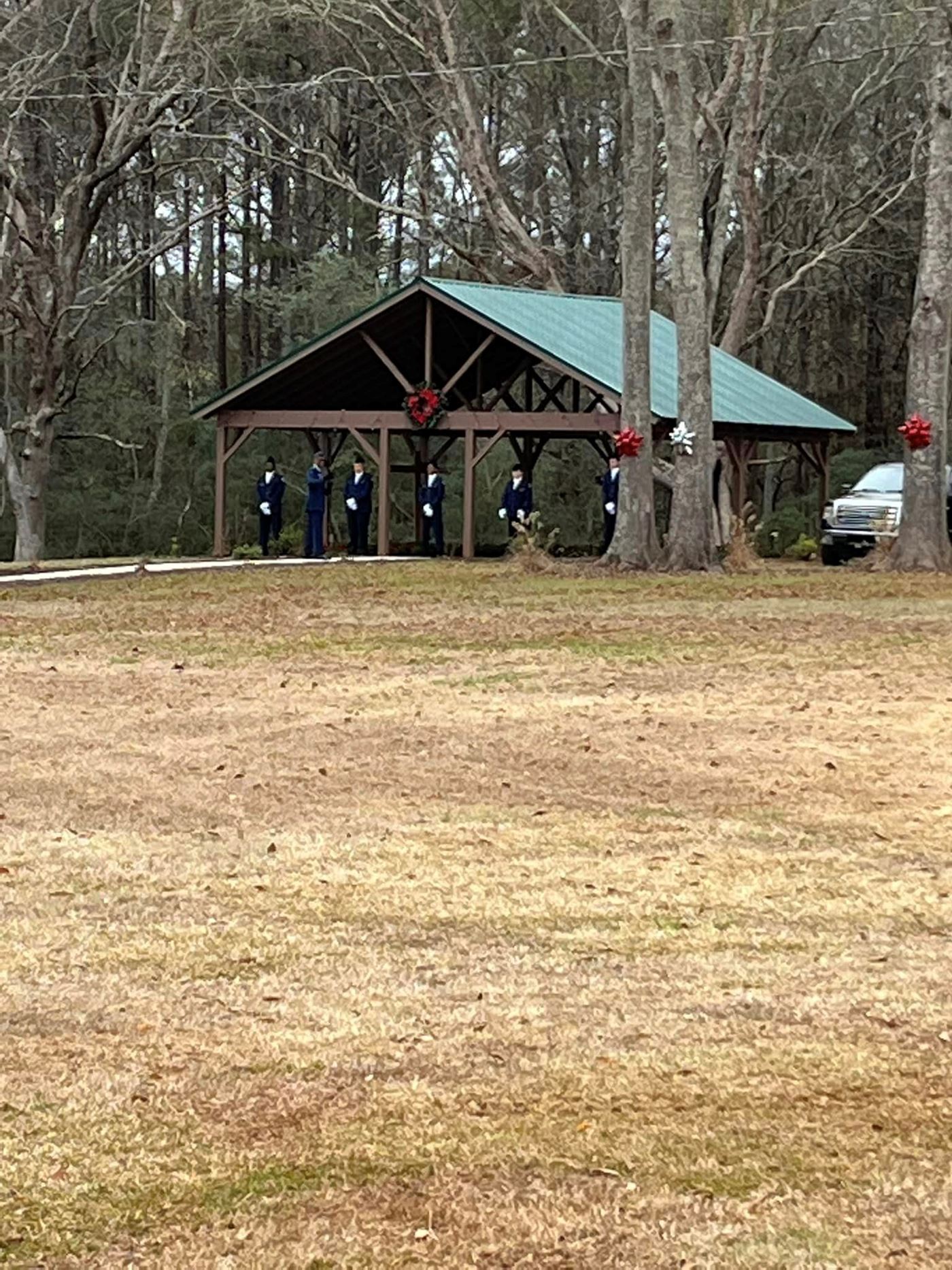 Cadets stand at attention waiting to hand out wreaths.