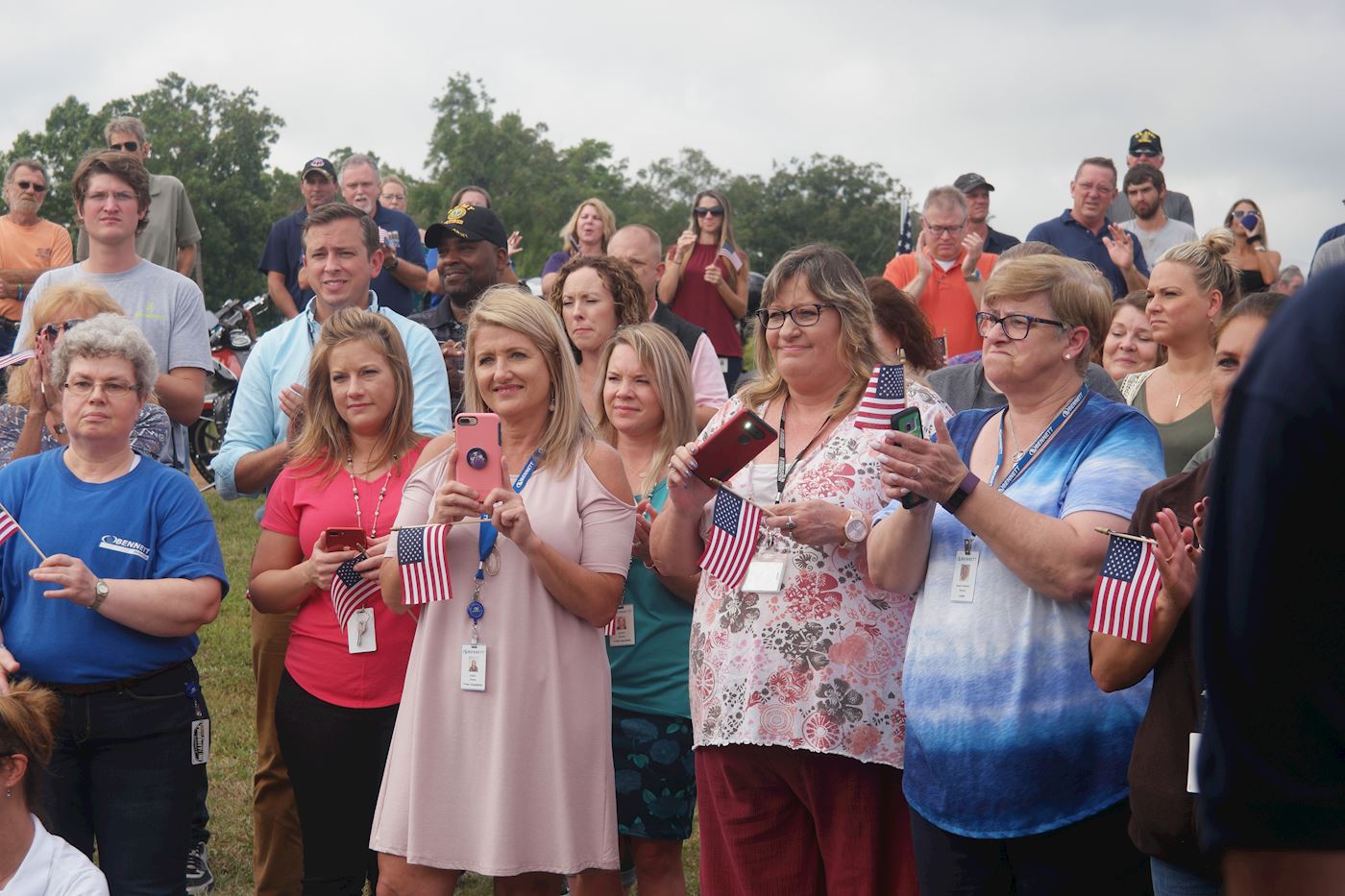 Bennett Home Office employees show their patriotism at the Wreaths of Honor Ride reception on the lawn.