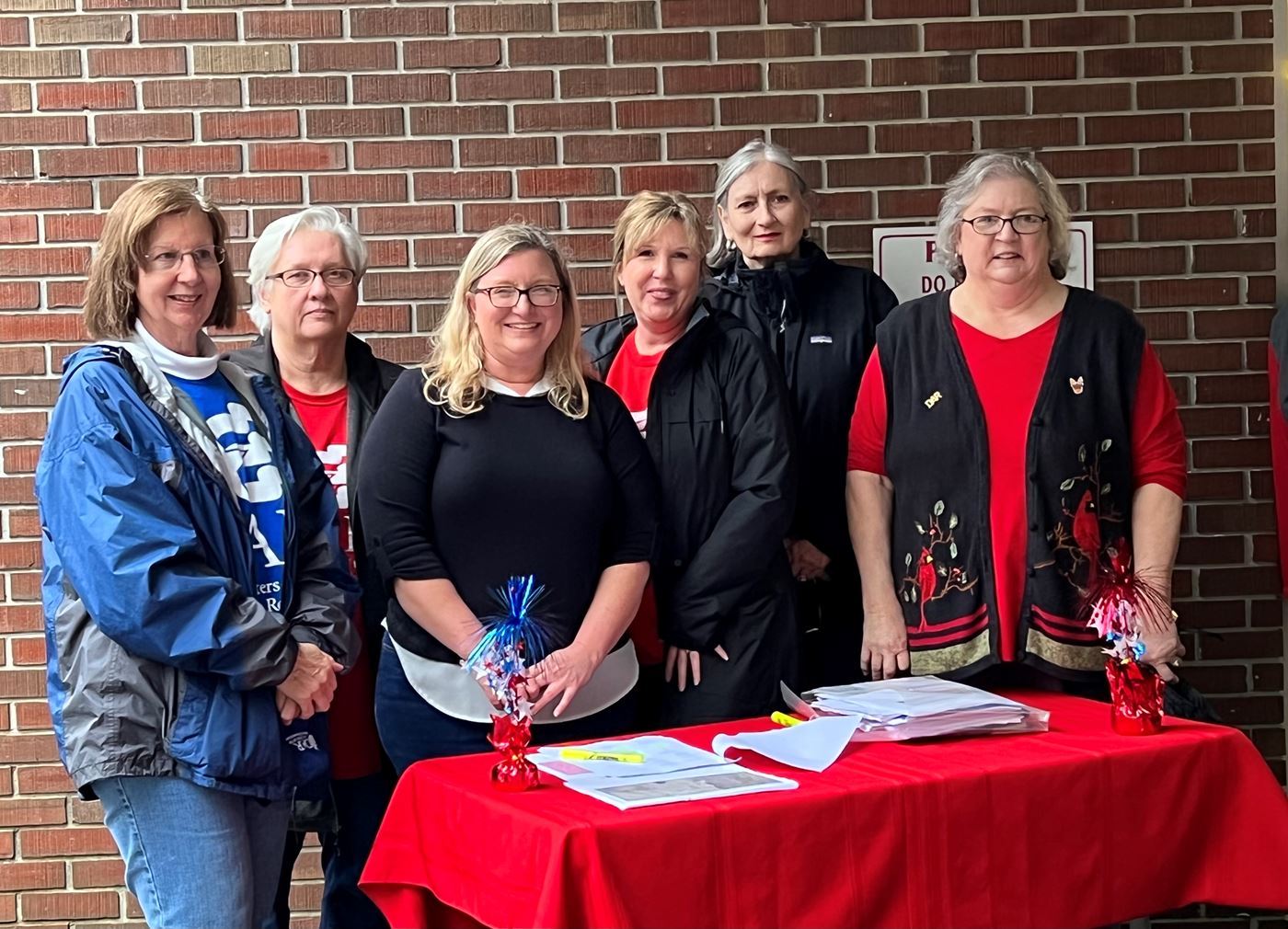 Seeking Shelter from Pouring Rain, Josiah Brunson Chapter Members Assisted Families with Remembrance Wreath Distribution