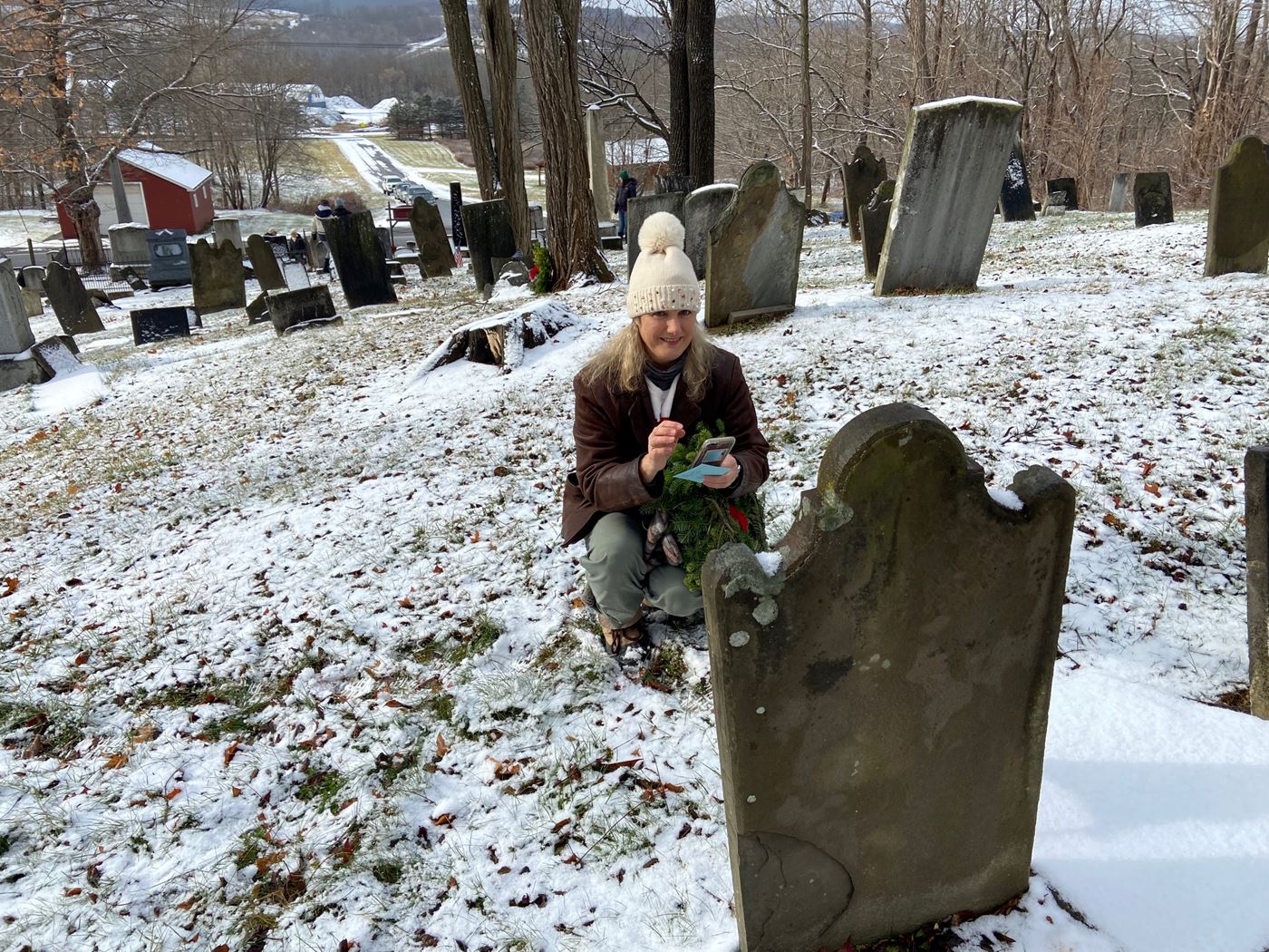 Volunteer placing wreath at Bristol Center Cemetery, Bristol NY 2022