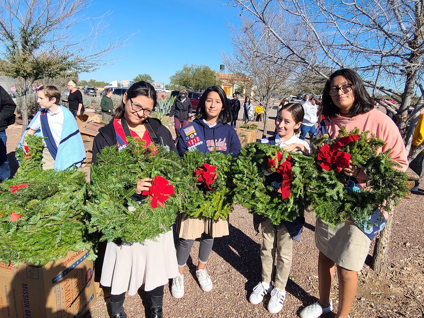Girls holding wreaths