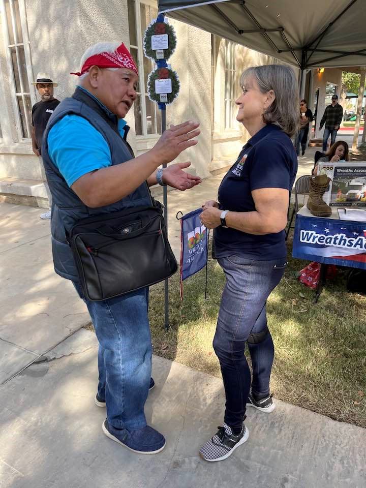 Desert Palm Chapter member Julie Plemmons visits with veterans at the Veterans Day Parade in Holtville, California 2022.