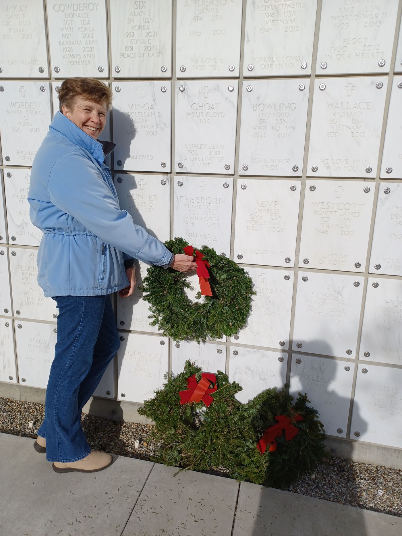 BRWF Member Penny Martinez laying a wreath at Clarence and Mildred Freeborn grave site