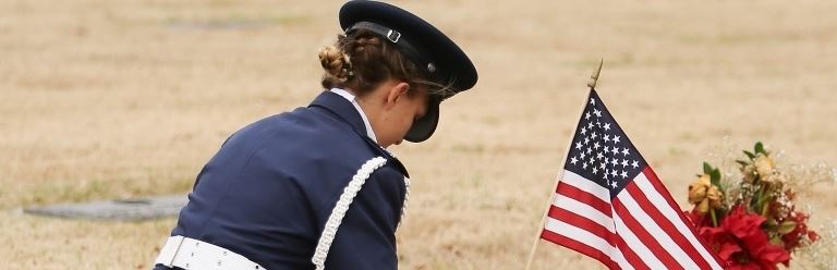 Cadet Phillips places a wreath on her grandfather's grave at Rest Haven Memorial Park 2015 National Wreaths Across America Day