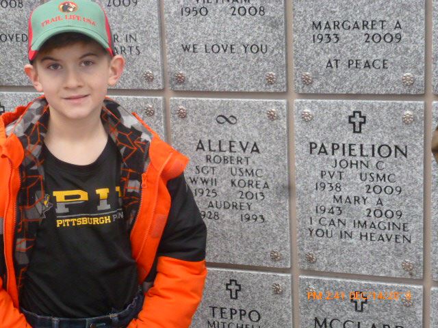 A Trailman honors John Papielion at the memory
wall in Saratoga National Cemetery.