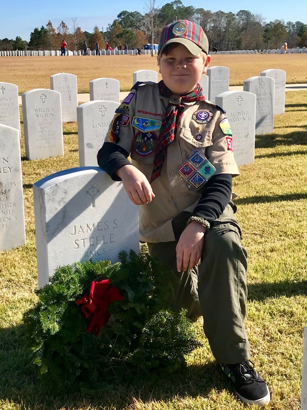 Conner Steele Pack 522 Weblos after placing his Grandfather's wreath in Section 7