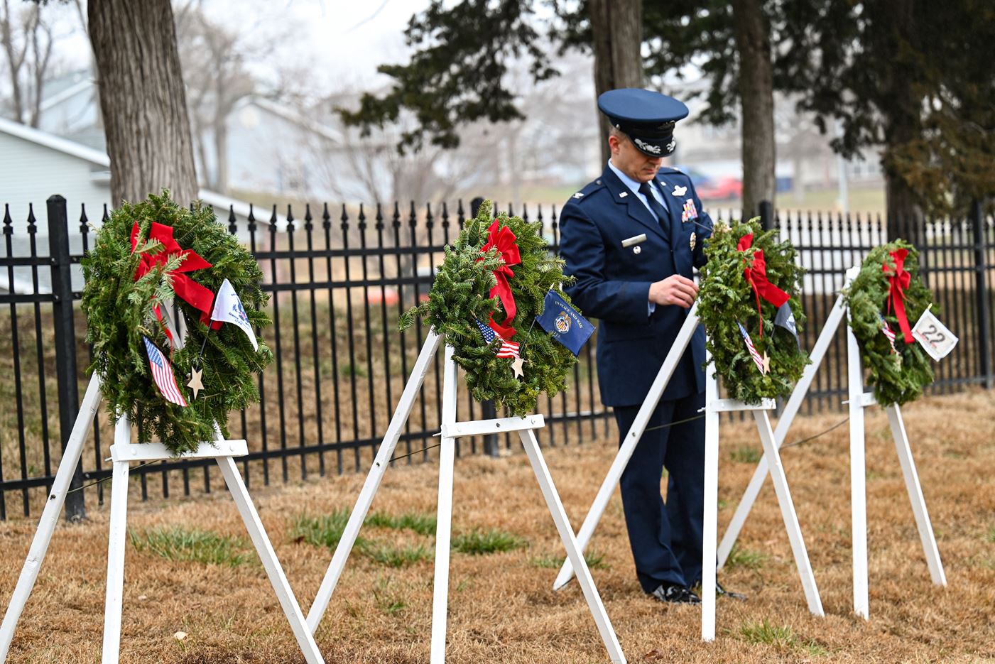 Col. Aaron Gray setting up ceremony wreaths from indoor ceremony to cemetery&nbsp;