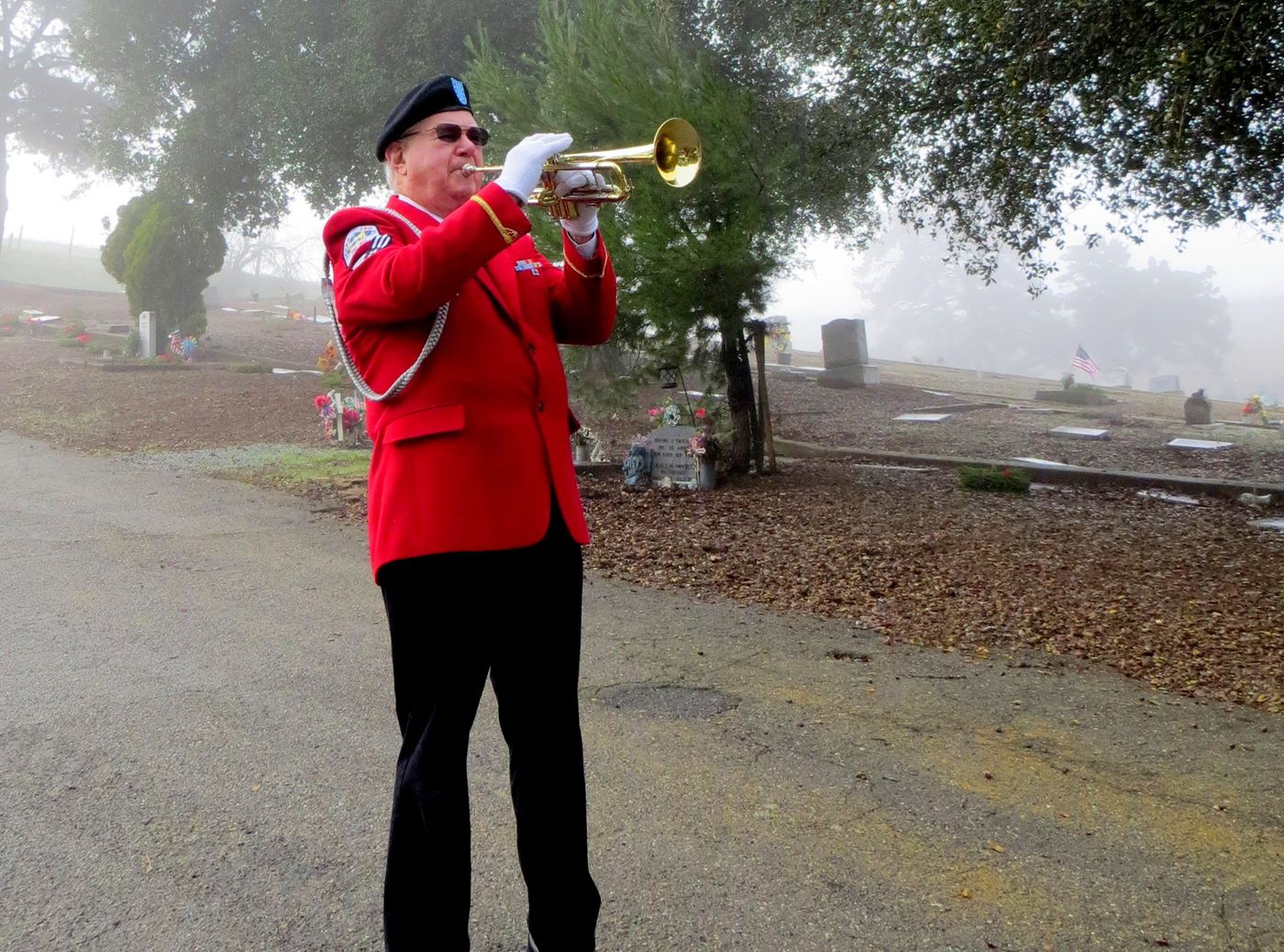 At the end of the dedication and opening ceremony, taps is played across the quiet misty cemetery.  Mt. Hope Cemetery, Morgan Hill, California