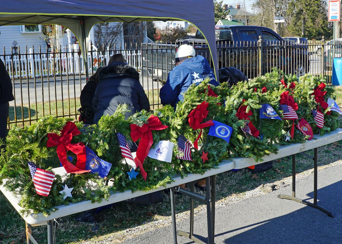 All Memorial Wreath are prepped before the Ceremony by Location Coordinator Anne Quinn.