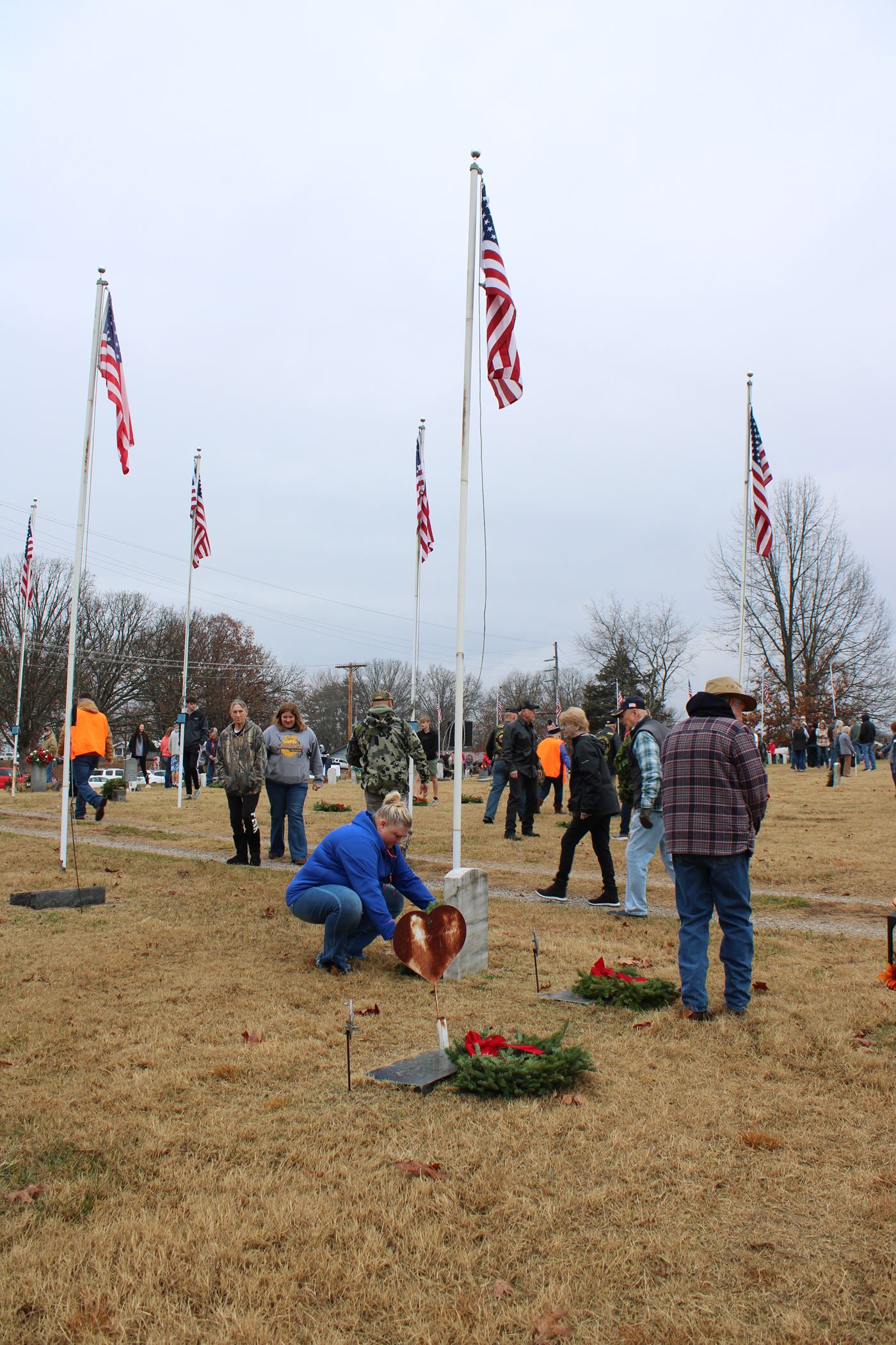 Family members, Veterans and Volunteers gathered together to Remember - Honor - Teach <br>