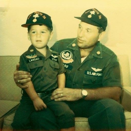 <i class="material-icons" data-template="memories-icon">chat_bubble</i><br/>Howard Burton Landau, Air Force, Colonel<br/>Posted by: Traci Pasqualone<br/><div class='remember-wall-long-description'>In Memory of a devoted father and an extremely proud U.S. Air Force veteran who served in WWII, Korea, and Vietnam.
This photo, taken when we were stationed in the Philippines, also holds my brother Dean, whom we lost nearly two years ago. Every time he was back on the East Coast, he never missed a chance to visit Dad’s grave at Arlington — a tradition that meant so much to him. During the holidays, he would even ask friends who lived in the D.C. area to visit and take photos of Dad’s grave with a holiday wreath, which is why the Wreaths Across America initiative means so much to our family.
Remembering them both this holiday season with love. They are always in my thoughts and heart.</div><a class='btn btn-primary btn-sm mt-2 remember-wall-toggle-long-description' onclick='initRememberWallToggleLongDescriptionBtn(this)'>Learn more</a>